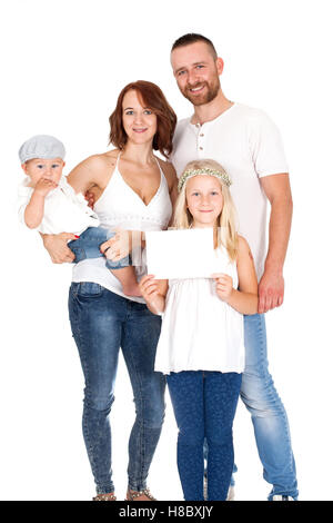 family, a group of people in white shirts and jeans holding a card Stock Photo