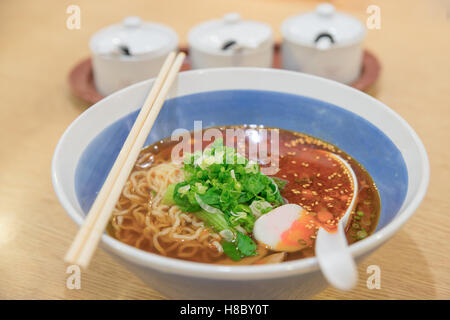 Spicy asian ramen noodle soup in bowl.