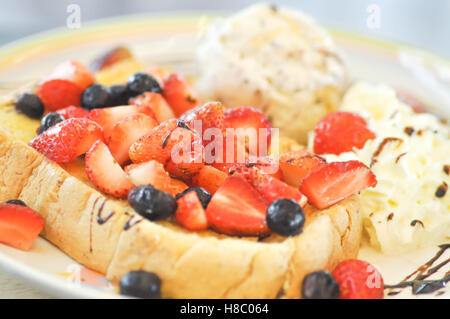 French toast with strawberry ,blueberry and ice cream dish Stock Photo