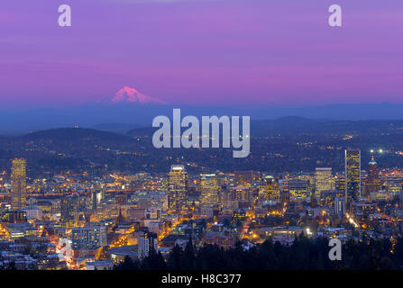 Downtown Portland Oregon Cityscape with Mount Hood during evening time after sunset Stock Photo