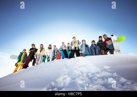 Group of skiers and snowboarders Stock Photo