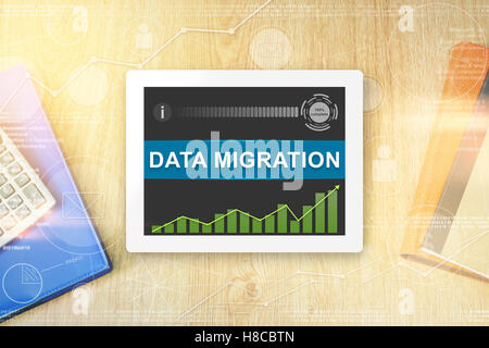 data migration word on tablet with soft light vintage effect Stock Photo