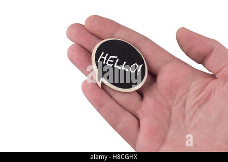 hand holding a wooden black speech bubble with hello text on it isolated on white Stock Photo