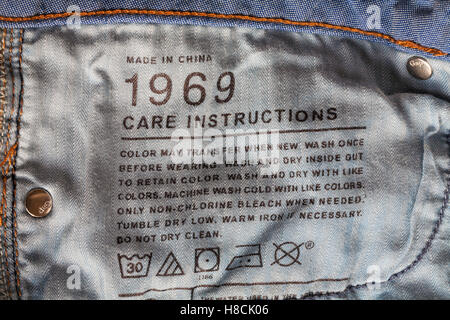 Care instructions stamped in GAP 1969 denim jeans made in China Stock Photo