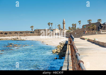 CAESAREA, ISRAEL - APRIL 2, 2016: fishermen on a territory of  Maritima National Park in Caesarea, Israel Stock Photo