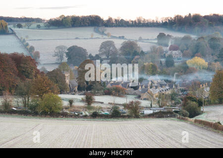 Frosty autumn morning at sunrise overlooking Upper Slaughter. Cotswolds, Gloucestershire, England Stock Photo