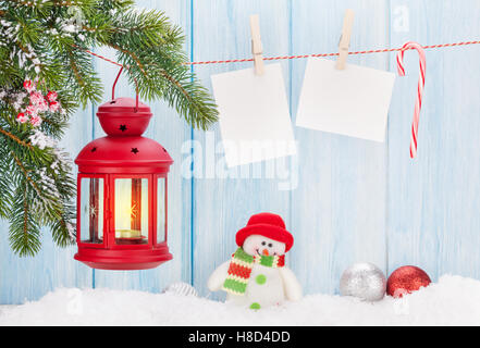Christmas candle lantern and blank photo frames Stock Photo