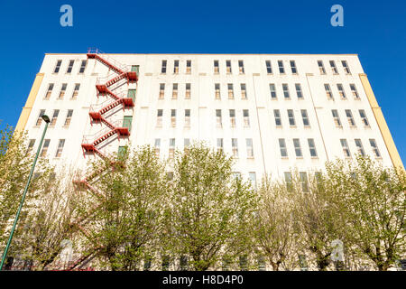 Old warehouse building with exterior fire escape. Originally used by John Player and Sons, Nottingham, England, UK Stock Photo