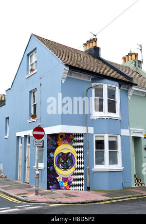 Corner house with a quirky cat mural painted on end wall in Hanover district of Brighton UK Stock Photo