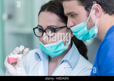 Students with dental prosthesis, dentures, prosthetics work. Stock Photo