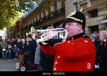 Peterborough, UK. 11th Nov, 2016. Armistice Day. Veterans prepare for the two-minute silence as a bugler from The Royal Anglian Regiment prepares to play The Last Post. People marking Armistice Day in Peterborough, UK. A two-minute silence is held across the country on the eleventh hour of the eleventh day in the eleventh month, marking the end of the First World War.  Credit:  Paul Marriott/Alamy Live News Stock Photo