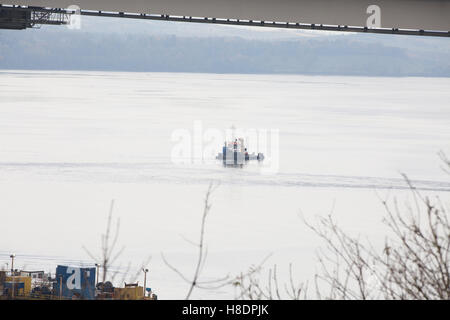 Queensferry, Edinburgh, Scotland, 11th, November, 2016. Forth Bridges.  The 2nd Road bridge is nearing completion.  A Tug is standing-by to assist the floating pontoon if required.  Phil Hutchinson/Alamy Live News Stock Photo