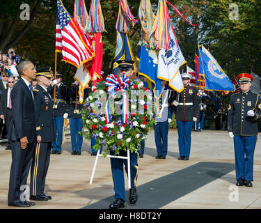 Arlington, Us. 11th Nov, 2016. United States President Barack Obama, left, and US Army Major General Bradley A. Becker, Commander, US Army Military District of Washington, left center, stand at attention during a wreath-laying ceremony at the Tomb of the Unknown Soldier at Arlington National Cemetery in Arlington, Virginia on Veteran's Day, Friday, November 11, 2016. Credit: Ron Sachs/Pool via CNP/dpa/Alamy Live News Stock Photo