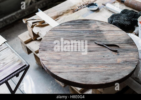 Old rusty steel pliers on wooden background Stock Photo