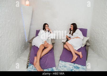 Two women relaxing in a salt cave at Halotherapy Stock Photo