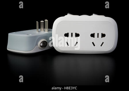 two white power sockets with switiches on black background Stock Photo