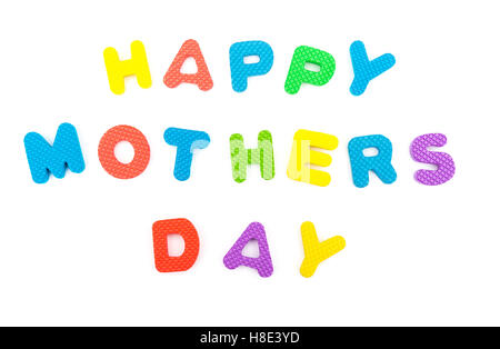 words of happy mothers day shaped by alphabet jigsaw puzzle on white Stock Photo