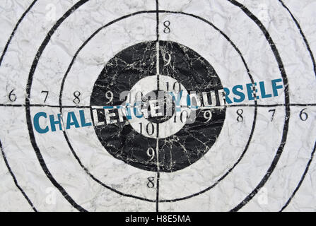 Text Challenge Yourself written in the center of a target Stock Photo