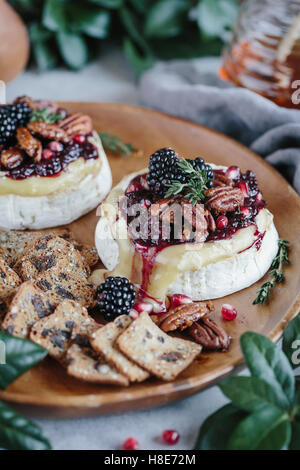Baked Brie with Blackberry Compote and Spicy Candied Pecans Stock Photo