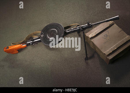 Weapon lies on the boxes of ammunition. Light machine gun DP. Weapon on the floor. Stock Photo