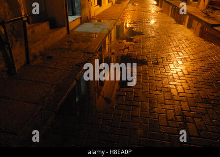 Floodlit street in Havana Centro at night, Havana, Cuba, West Indies. Stock Photo