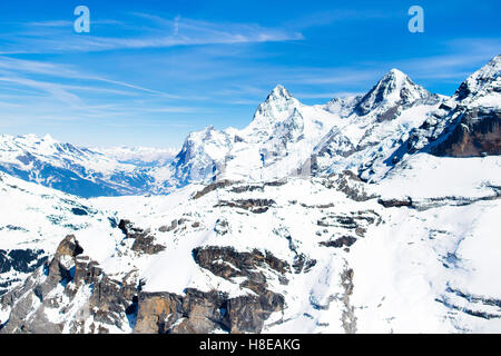 Aerial view of the Alps mountains in Switzerland. View from helicopter above glacier in Swiss Alps. Stock Photo