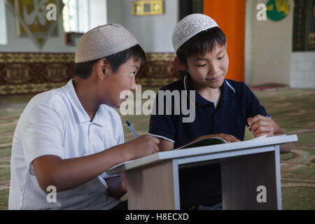 Kyrgyzstan - pictures of boys at medressa, islamic school  -  Travel people Central Asia Stock Photo