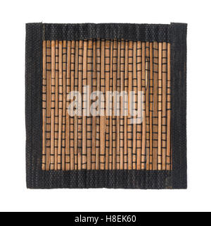 Brown bamboo straw mat with black fabric border for background and texture, isolated on white background Stock Photo