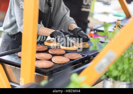 Beef burgers ready to serve on food stall. Stock Photo