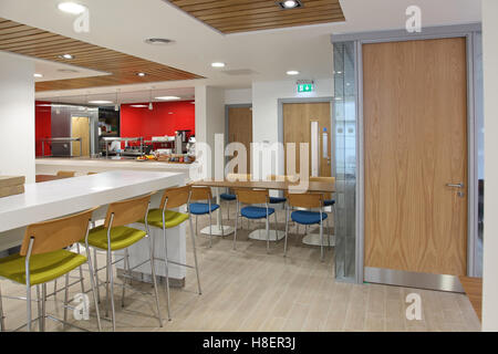 Newly fitted-out staff restaurant area in a London office building. Shows seating, bar area and servery. Stock Photo