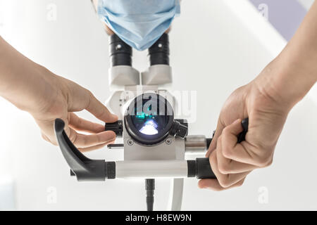 Using a dental microscope Stock Photo