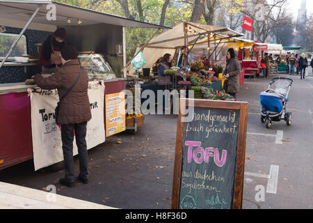 View of weekly Eko-Markt, or Eco-Market, at Kollwitzplatz in gentrified Prenzlauer Berg neighbourhood of Berlin , Germany Stock Photo