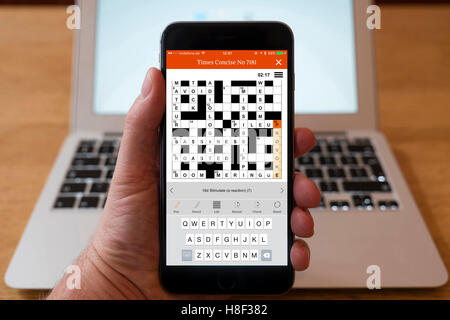 Detail of The Time crossword puzzle being solved on a smart phone Stock Photo