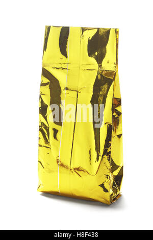 Golden Yellow Aluminum Pouch on White Background Stock Photo