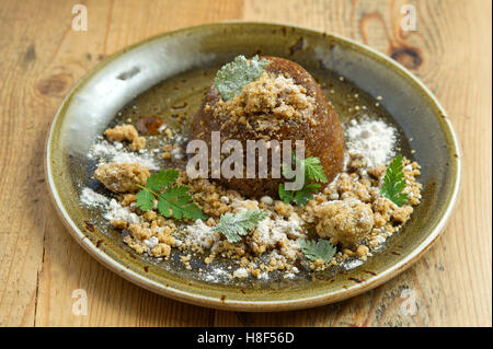 Ethicurian sticky toffee apple cake pudding. a UK food Stock Photo