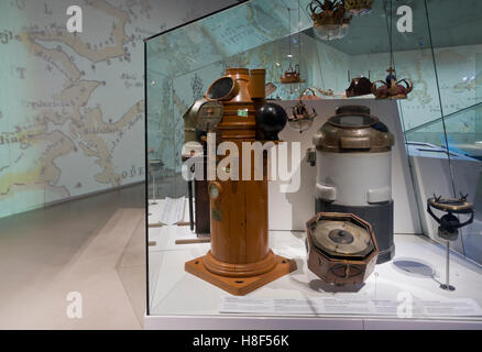 Old binnacles, compasses and nautical equipment at the underground Danish Maritime Museum, M/S Museet for Søfart, in Elsinore / Helsingør, Denmark. Stock Photo