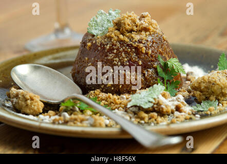 Ethicurian sticky toffee apple cake pudding. a UK food Stock Photo