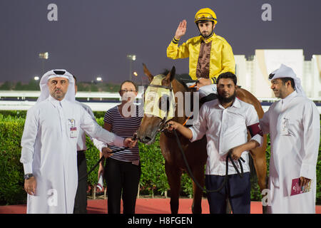 DOHA, QATAR - November 3rd 2016 Qatar Racing and Equestrian Club. Alberto Sanna with Sky Metro after winning race 2 of the secon Stock Photo
