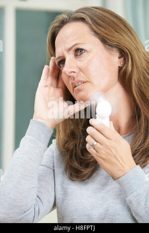 Mature Woman Experiencing Hot Flush From Menopause Stock Photo