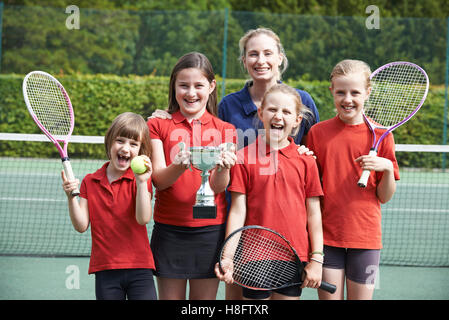 Victorious School Tennis Team With Trophy Stock Photo