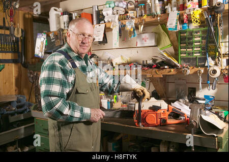 Man working at his work bench Stock Photo