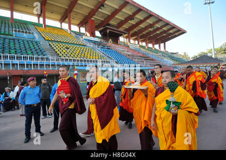 Kathmandu, Nepal. 11th November, 2016. Nepalese Buddhist Kora Arounds World's largest Thangka Painting of 12 important lifestyle of the Lord Gautam Buddha showcased at Dashrath Rangasala Stadium, Kathmandu, Nepal on Friday, November 11, 2016. The effort of more than 10,000 volunteers from over 16 countries, the thangka was finally completed in 2002. The painting representing 12 important lifestyle of the Lord Gautam Buddha. Credit:  PACIFIC PRESS/Alamy Live News Stock Photo