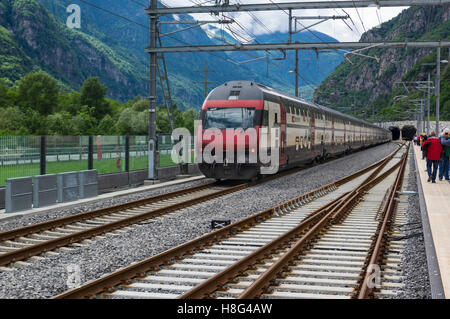 Northbound SBB IC 2000 double-decker passenger train entering the south portal of the 57km long Gotthard base tunnel. Pollegio, Ticino, Switzerland. Stock Photo