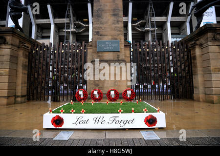 Poppy wreaths are laid in front of the Rose and Poppy gates outside the stadium ahead of the Autumn International match at Twickenham Stadium, London. Stock Photo