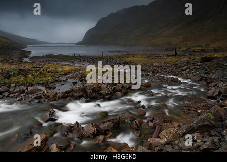 The Lairige Lochan, Ben Lawers dam and surrounding mountains are shrouded in low cloud. Stock Photo