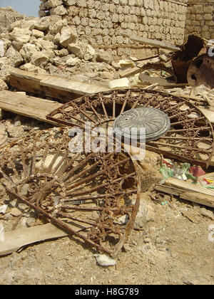 15th September 2005 19th century fan-lights of rusted intricate metal-work lie among the rubble in Suakin in north-east Sudan. Stock Photo