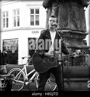 Copenhagen, denmark - november 08, 2014 Street musician sing and plays guitar on strøget, copenhagen. Stock Photo