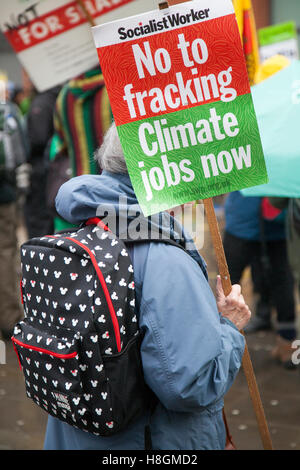 Manchester, UK. 12th Nov, 2016. Socialist Worker, No to Fracking; Climate Jobs Now.. A massive anti-fracking demo takes place in Piccadilly Gardens, Manchester. Protesters, with posters and placards,  gathered to fight against the recent issuing of fracking licenses to companies involved in the shale gas industry. The controversial fracturing method to release trapped natural gas has faced fierce opposition from residents of the areas affected. Credit:  Mediaworld Images/Alamy Live News Stock Photo