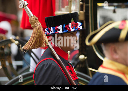 City of London, UK. 12th November, 2016. The world’s largest unrehearsed procession, The Lord Mayor’s Show, takes place through the City of London from the Guildhall to The Royal Courts of Justice on the Strand where Dr Andrew Parmley is sworn in on his first day in office. The ancient carnival is 801 years old this year and takes place in cold, wet weather in spite of which crowds line the route. Yeoman Warders escort the Late Lord Mayor. Credit:  Malcolm Park editorial/Alamy Live News.