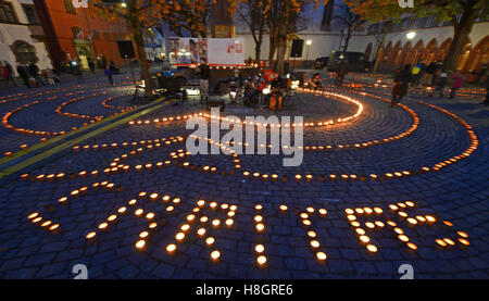 Freiburg, Germany. 12th Nov, 2016. Candles in the city hall square in Freiburg, Germany, 12 November 2016. Catholic charities and civil society groups have launched an initiative called 'One Million Stars' in support of a more just world. Photo: Patrick Seeger/dpa/Alamy Live News Stock Photo